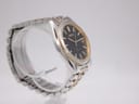 Another angled view of the Seiko watch, highlighting the case shape and the two-tone stainless steel bracelet.