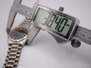 Digital caliper measuring the case diameter of the Seiko watch at 38.40mm.