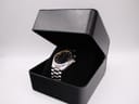 The Seiko kinetic watch displayed in a generic black watch box.