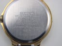 Close-up of the stainless steel case back with Seiko branding and model number 3E29-0120 engraving.