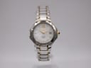 Front view of Seiko Coutura two-tone watch with mother of pearl dial and gold-tone Roman numerals.