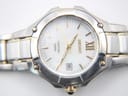 Close-up of the Seiko Coutura white mother of pearl dial, gold-tone indices, and date window.