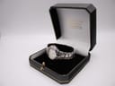 Seiko Coutura watch displayed in an open black and gold-trimmed gift box.