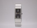 Front view of Seiko 4N00-7029 rectangular quartz watch with black dial and gold-tone hands.