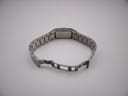 Rear view of the watch showing the integrated stainless steel bracelet with the deployant clasp open.