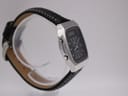 Angled left-side view of the Seiko H556-5030 watch, showing pushers and case profile on a stand.