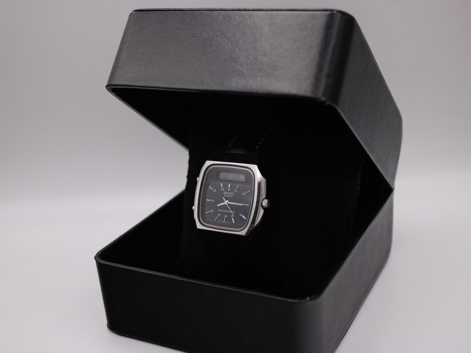 Front view of the Seiko H556-5030 watch presented in a black watch box.