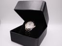 The Seiko watch presented inside a generic black watch box.