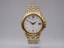 Front view of gold-tone Seiko 5M62-0B20 kinetic watch with white dial, Roman numeral at 12, date at 3, and gold-tone bracelet.