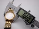 Digital caliper measuring the case diameter of the watch, displaying 36.68mm.