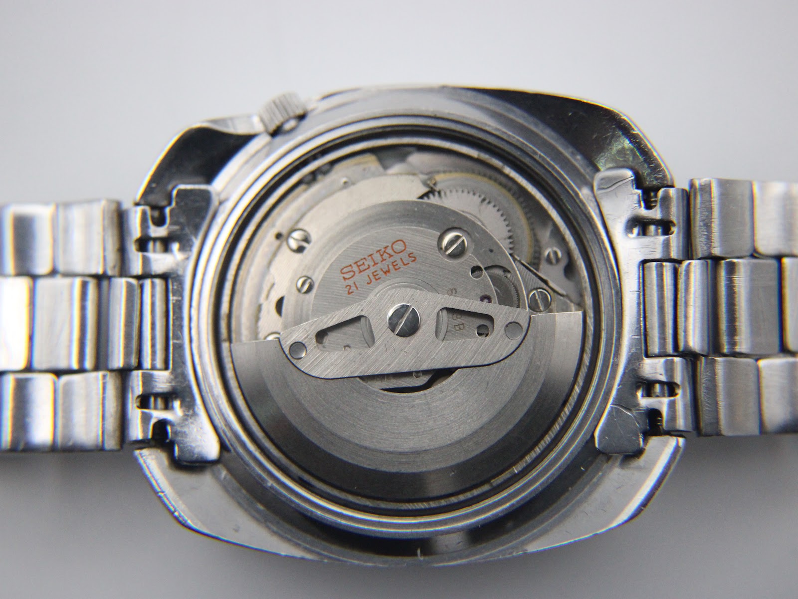 View of the Seiko 6119 automatic 21 jewels movement with its rotor, visible after case back removal.