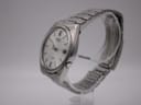 Side profile of the Seiko watch, showing the brushed case and integrated-style steel bracelet.