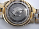Rear view of the Seiko watch case back, showing model and serial numbers, and the original integrated steel bracelet.