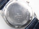 Rear view showing the Seiko stainless steel caseback engravings and serial number detail.