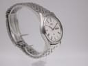 Another angled side profile of the Seiko watch, showing the elegant curve of the case and the stainless steel bracelet