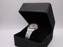 The Seiko 7123-8340 watch resting on a black velvet cushion inside a generic presentation box
