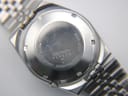 Close-up of the stainless steel case back of the SEIKO 6309-9000, showing serial number 857028 and model information.