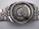 Macro shot revealing the SEIKO automatic 17-jewel movement inside the open watch case.
