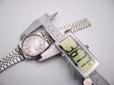 Digital caliper measuring the SEIKO watch case diameter, displaying 36.77mm.