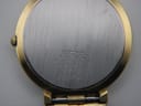 Close-up view of the brushed stainless steel case back with Seiko markings and serial number 211745.