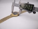Digital caliper measuring the Seiko watch case diameter at 35.03mm.