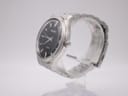 Right side profile of the Seiko quartz watch showing the stainless steel case and crown.