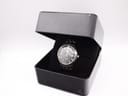 The Seiko watch presented in an open black display box.