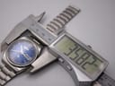 Digital caliper measuring the Seiko watch case, displaying a precise diameter of 36.82mm.