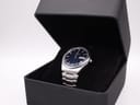 The Seiko 7546-8200 watch displayed inside an open black gift box with a velvet cushion.