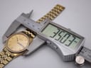 Digital caliper measuring the Seiko watch case, with the display showing a precise diameter of 35.03mm.