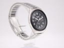 Close-up three-quarter view of the Seiko 8223-704B on a stand, highlighting the brushed finish of the case and bracelet.