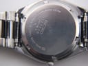 Detailed close-up of the stainless steel case back, showing 'SEIKO', model 8223-704B, serial number 120020, and 'WATER RESISTANT'.