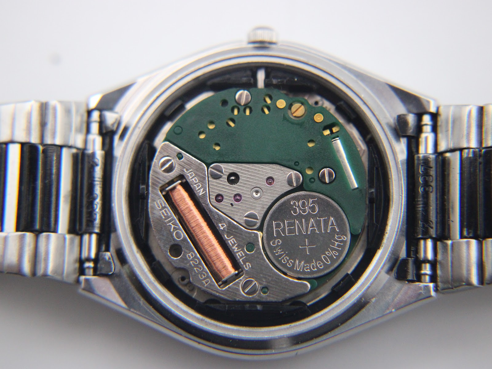 View of the open case back, revealing the Seiko 8223 quartz movement, 4 jewels, and a newly fitted Renata 395 battery.