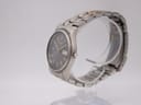Side profile view of the Seiko quartz watch showing the brushed titanium case and integrated bracelet.