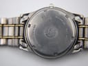 Close-up of the Seiko watch's case back, engraved with 'titanium' and 'water resistant 5 bar'.
