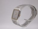Angled side profile of the vintage Seiko two-tone watch and its integrated bracelet.