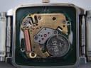 Internal view of the Seiko 6532B quartz movement with battery and intricate components.