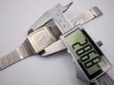 Digital caliper measuring the case diameter of the Seiko watch, displaying 28.62mm.