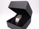 The Seiko two-tone watch presented in an open black display box with a velvet cushion.