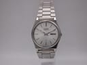 Front face of the Seiko 6923-8000 vintage quartz watch with silver sunburst dial and integrated bracelet.