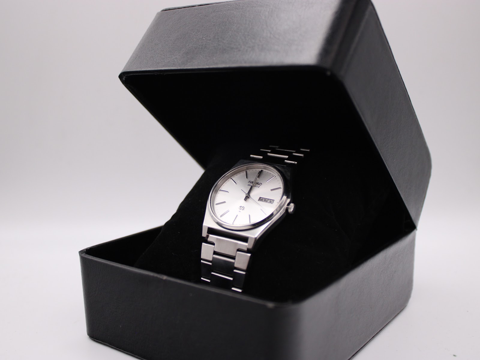 The Seiko 6923-8000 watch elegantly displayed in an open black presentation box.