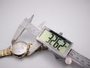 Close-up showing the watch's case diameter accurately measured at 32.62mm with digital callipers.