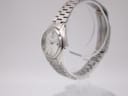 Side profile of the vintage Seiko watch showcasing its integrated stainless steel bracelet.