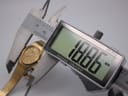 Digital caliper measuring the case diameter of the Seiko watch, displaying 18.86mm.