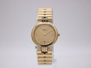 Front view of a vintage gold-tone Seiko quartz watch with a gold dial and matching integrated bracelet.