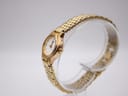 Side profile of the small gold-tone case and integrated bracelet links on the Seiko ladies' watch.