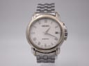 Front view of Seiko Kinetic two-tone watch with white textured dial and gold Roman numerals.