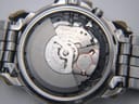 Detailed view of the Seiko 5M42A Kinetic movement inside the open case back.