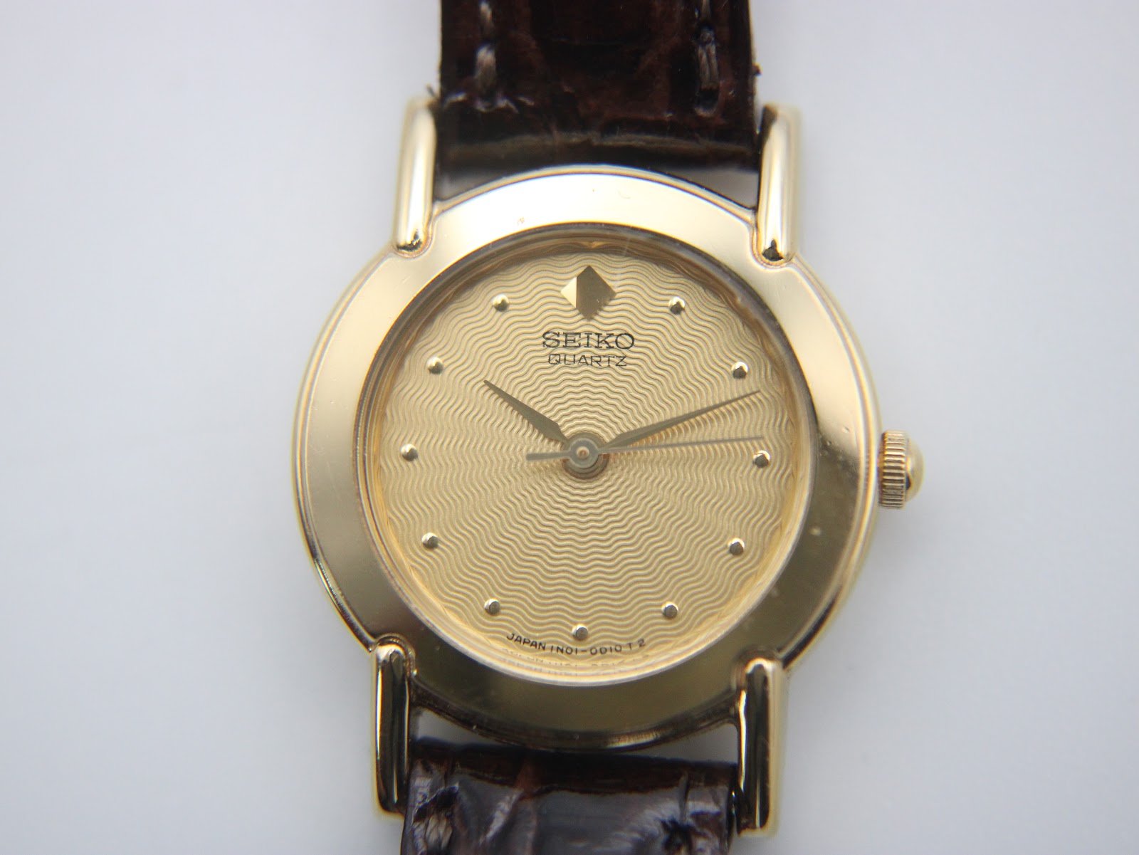 Reverse side of the watch showing the stainless steel case back markings.