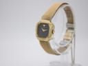 Side profile of the Seiko vintage quartz watch showing the textured case and mesh bracelet.